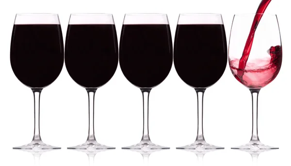 Reihe von fünf Weingläsern mit Spritzer — Stockfoto