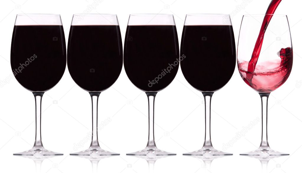 Row of five wineglasses with splash