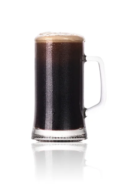 stock image Frosty glass of dark beer with foam and water drops isolated