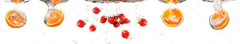 Collection of Juicy strawberry and orange under water. Healthy and tasty foods