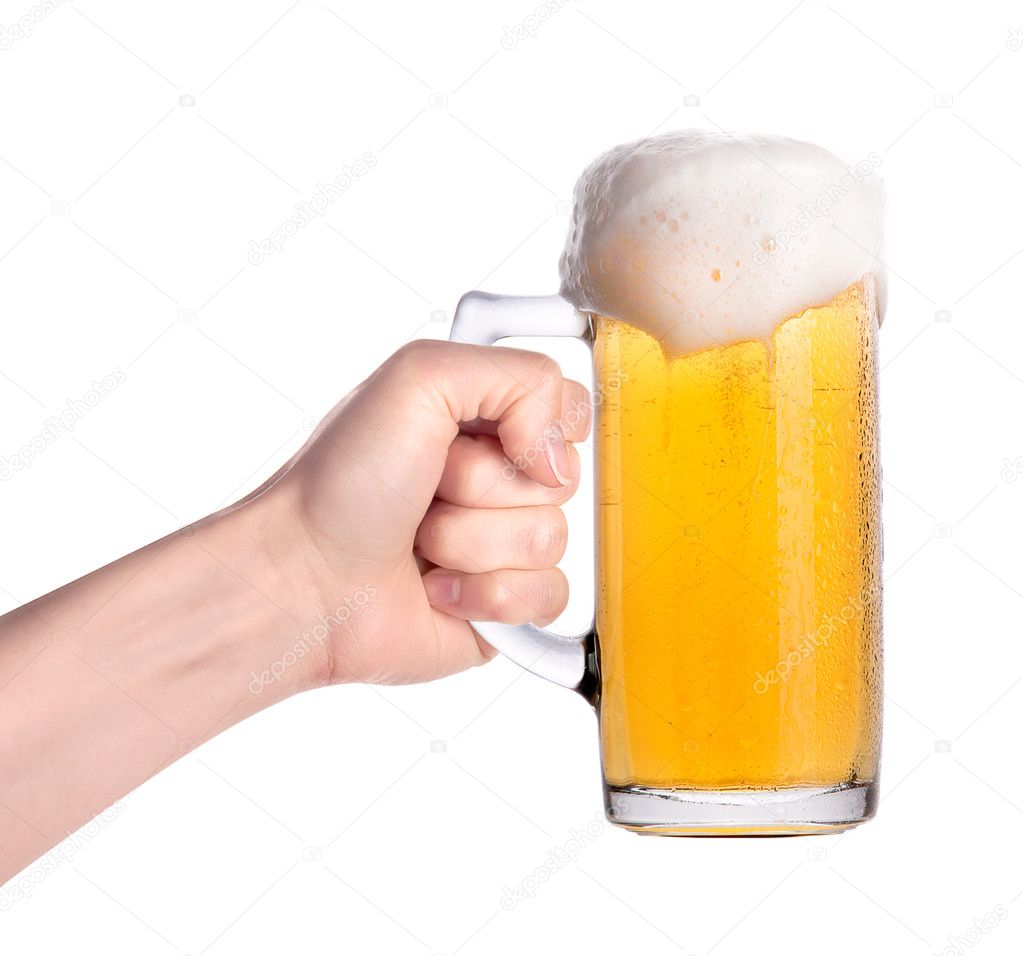 Hand holding glass of beer isolated.making toast