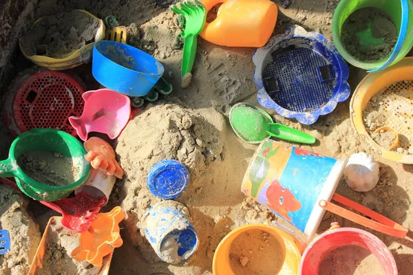 stock image Colorful toys in a sandpit