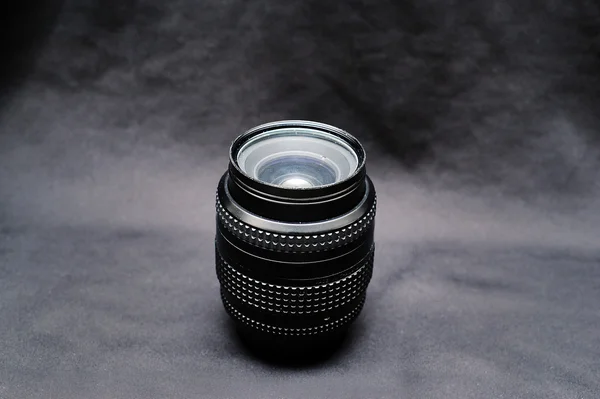 A lens for nikon on a black background