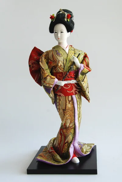 Muñeca en un kimono. China. Imagen de stock