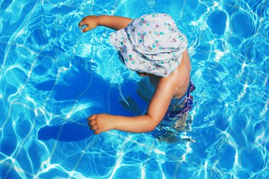 Child in swimming pool clipart