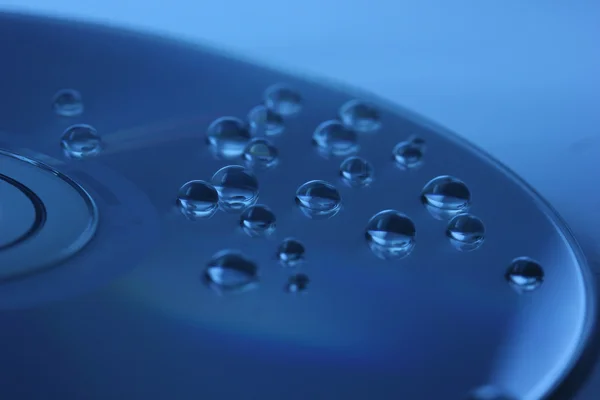 Abstrakt vatten droppar på disk — Stockfoto