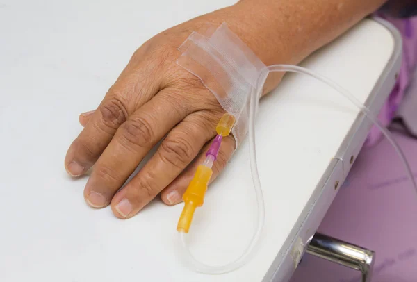 Elder patient with infusion — Stock Photo, Image