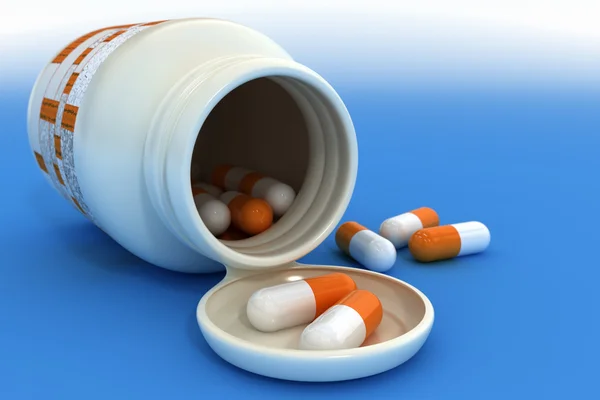 Orange piller i behållare — Stockfoto