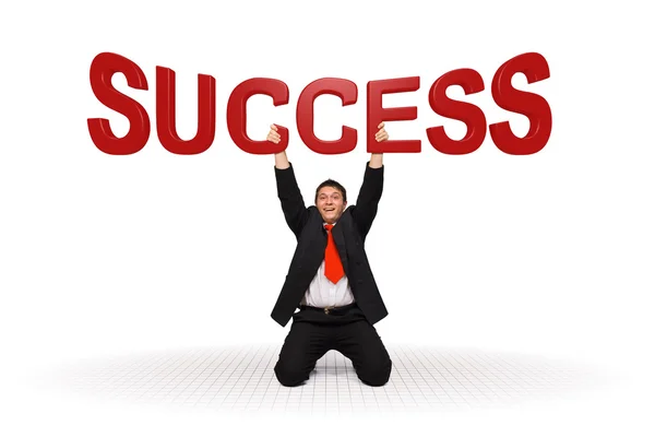Business man holding success text — Stockfoto