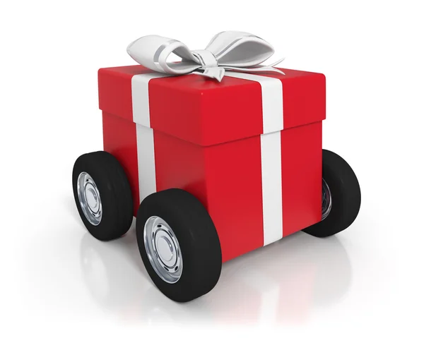 Rote Geschenkbox mit Rädern — Stockfoto