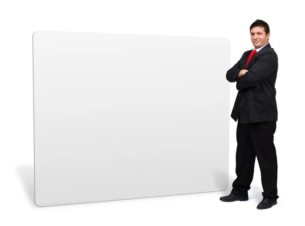 Hombre de negocios presentando una pizarra blanca vacía — Foto de Stock
