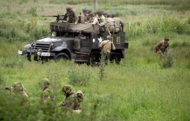 British world war to scouts with american half track in the background clipart