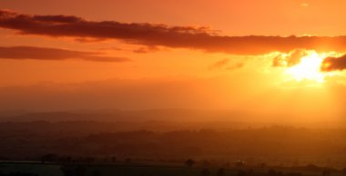 Sunet over the Honiton Moor clipart