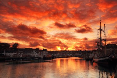 Sunset at the harbour clipart