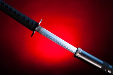 Drawn katana on red background clipart