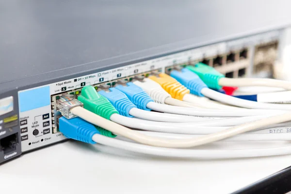 stock image Network cables connected into router