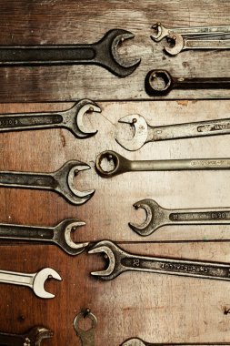 Set of wrenches hanging on a wall, do it yourself clipart