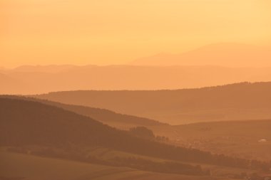 Overview of layered hills seen from Spissky castle clipart