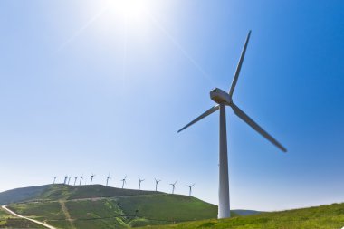 Wind turbine with more behind, horizontal shot clipart