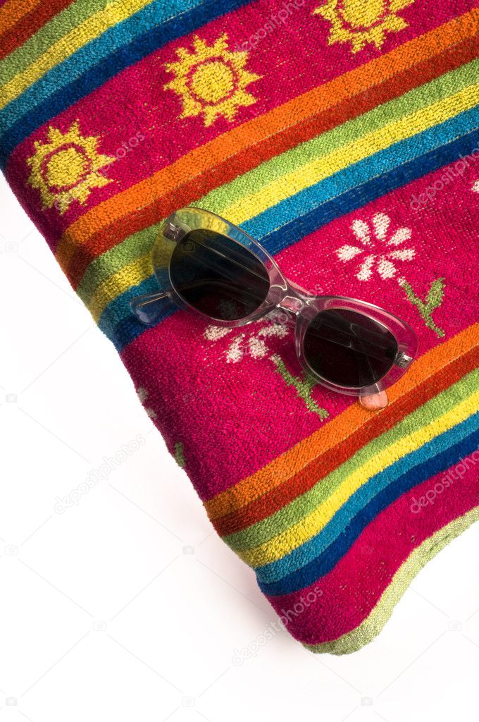 Towel and sun glasses