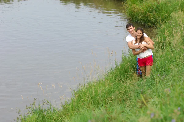 Love story. Running along the river, splashing — Stock Photo, Image