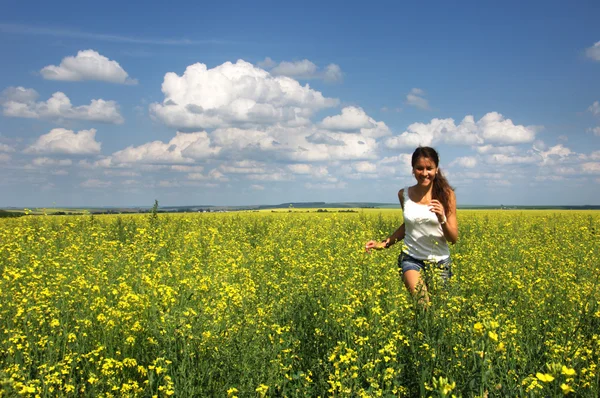 Love story. He and she, in the rape field. blue Sky — Stock Photo, Image
