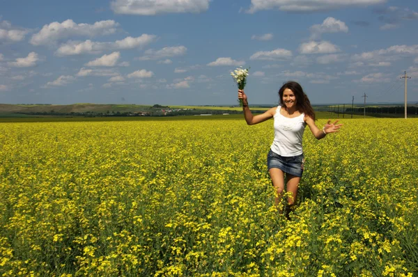 Love story. He and she, in the rape field. blue Sky — Stock Photo, Image