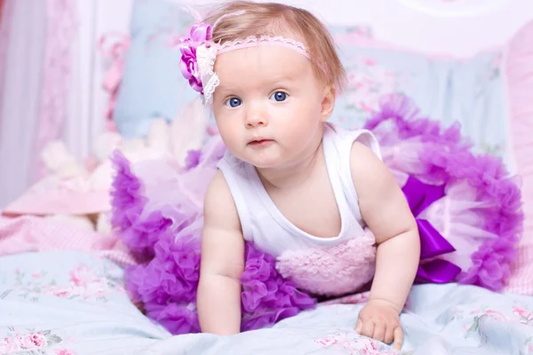 Baby with flower on head — Stock Photo, Image