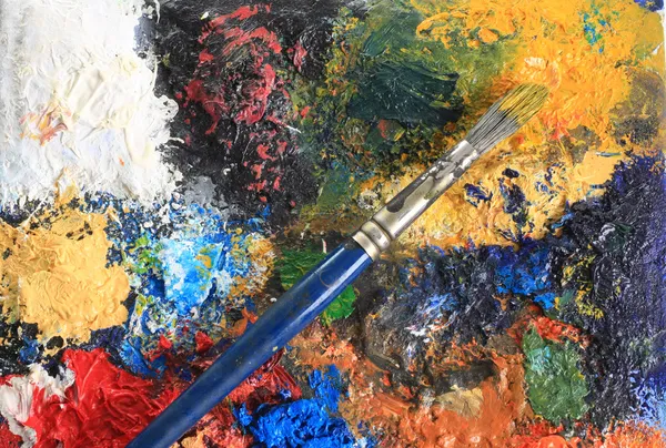 Paint brush and canvas — Stock Photo, Image