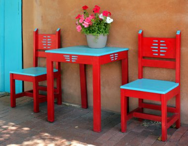 Old vintage red wooden chairs and table clipart