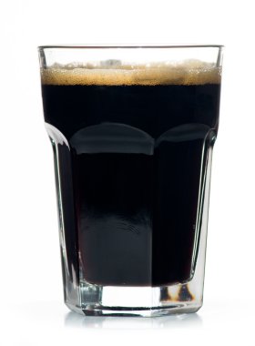 Beer glass full of cold black irish stout. clipart