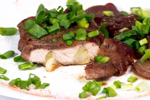 Grilled pork steak on white plate. — Stock Photo, Image