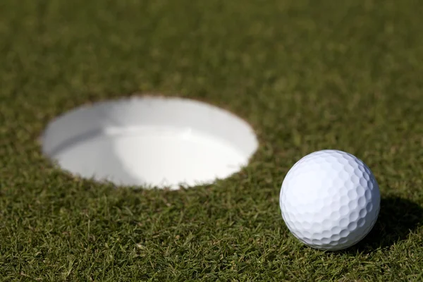 Golfball newar the hole — Stock Photo, Image