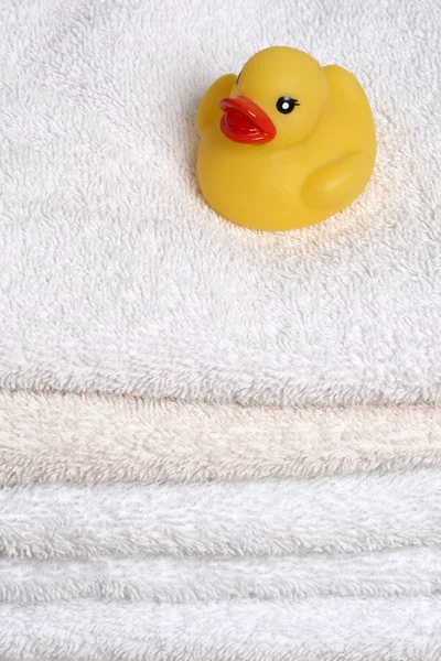 Stock image Rubber Ducky on bath towels