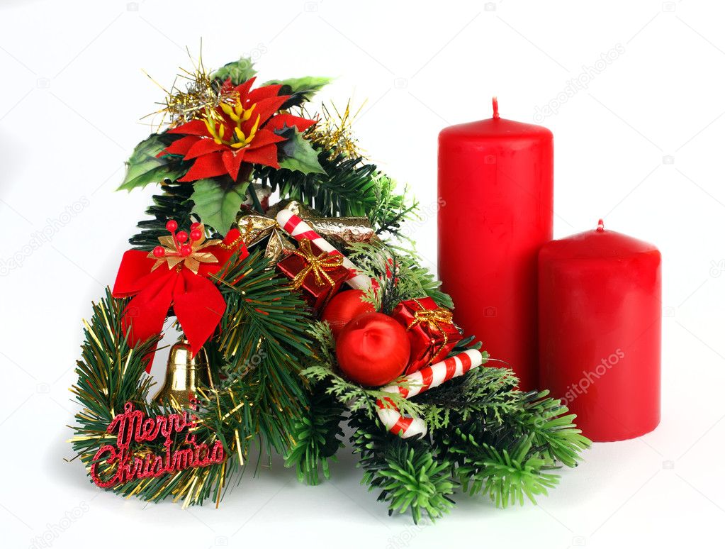 Christmas decoration with two red candles on white background