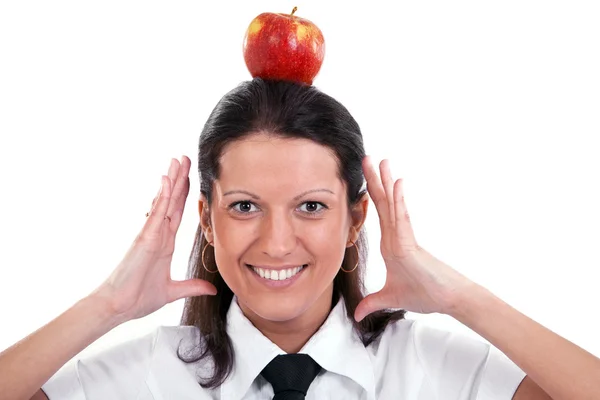 Young happy woman with apple on the head, isolated on white — Stock Photo, Image