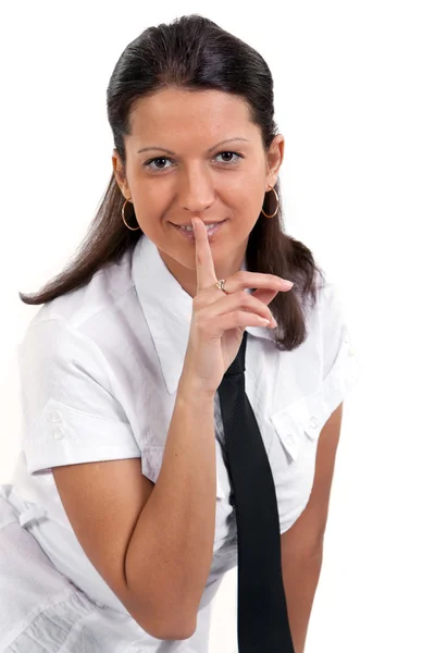 Young pretty woman with a finger on her lips in a hushing gestur — Stock Photo, Image