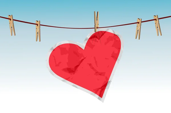 Corazón de papel en la cuerda — Vector de stock
