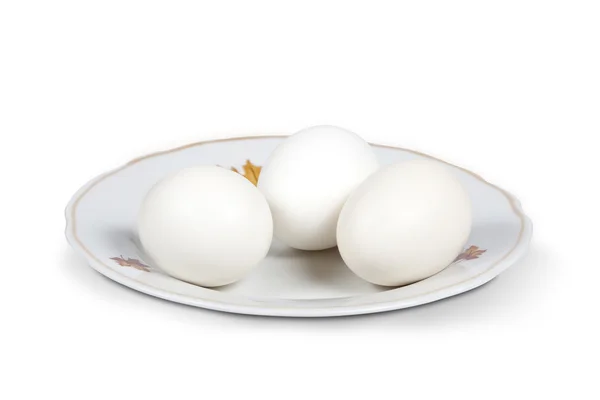 Huevos blancos en un plato — Foto de Stock