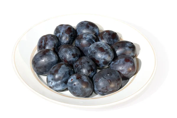 Ripe plums on a plate — Stock Photo, Image