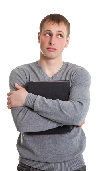 Die Studentin drückte sich ein dickes Buch an die Brust — Stockfoto