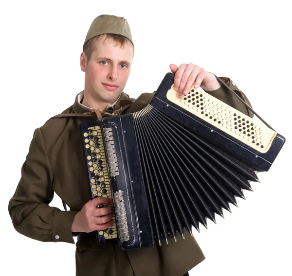 Een soldaat speelt de accordeon — Stockfoto