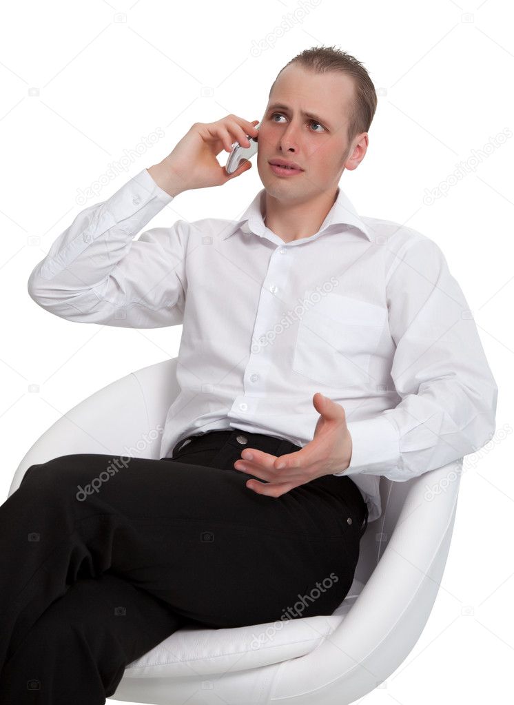 A businessman in a conversation on the phone solves the problem