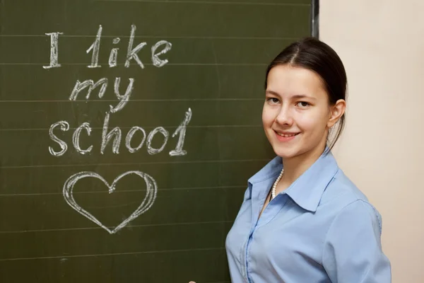 Menina em um conselho escolar — Fotografia de Stock