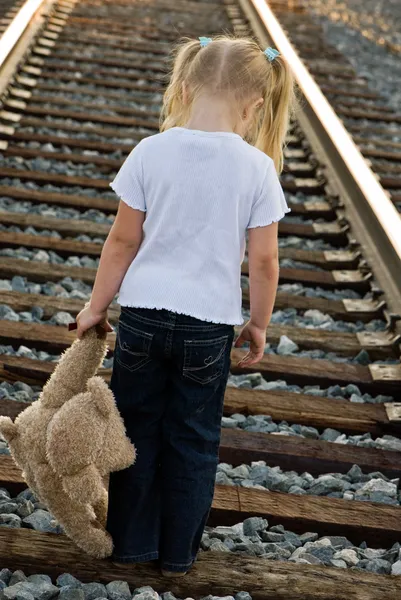 Sad child on railroad — Stock Photo, Image