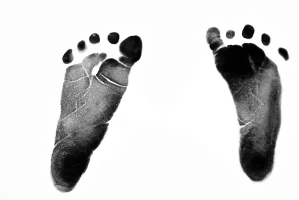 Spädbarnets fotavtryck på vit — Stockfoto