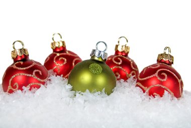 Holiday ornaments in snow clipart