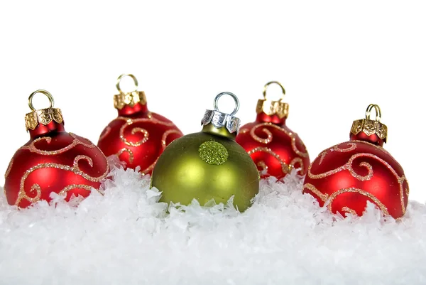 Holiday ornaments in snow — Stock Photo, Image