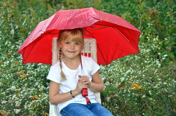 Girl with red umbrella — Stock Photo, Image