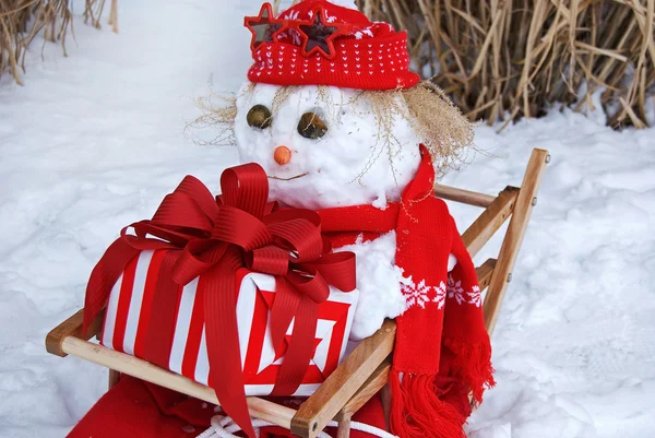 Christmas snowman in sled — Stockfoto